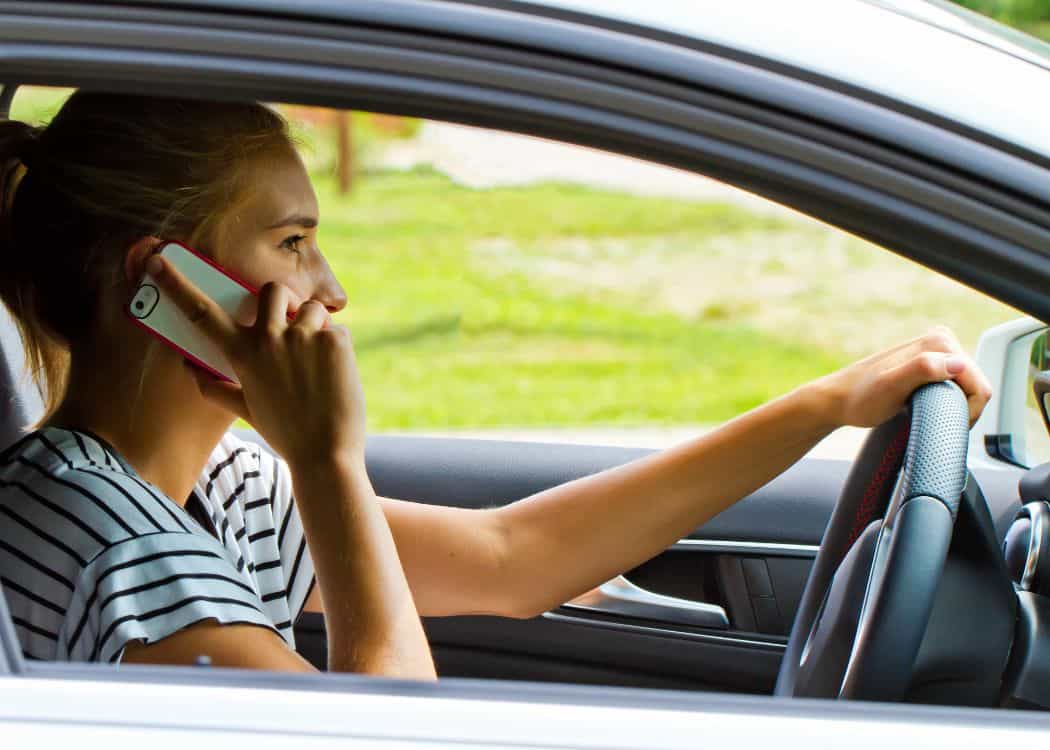 Girl on the phone while driving